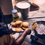 person cooking on black pan